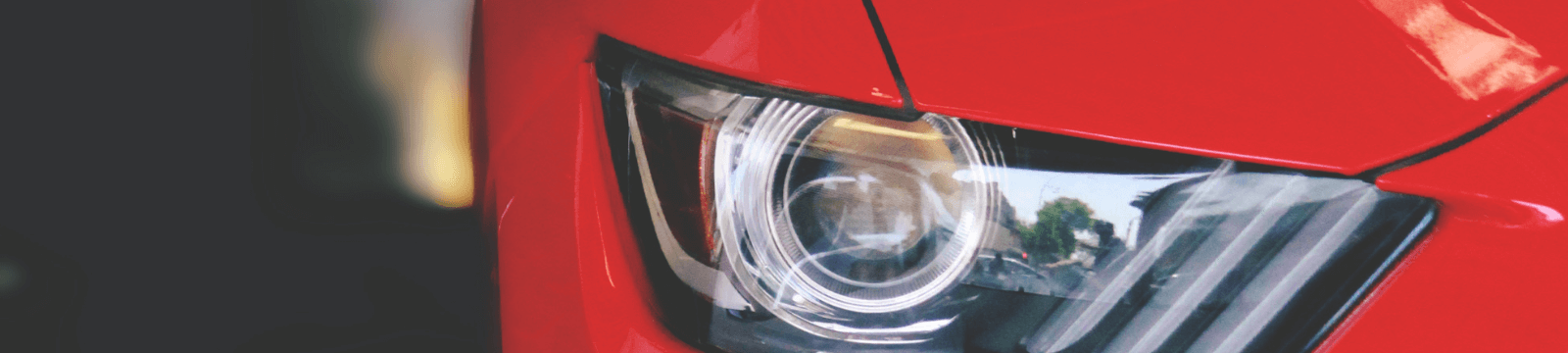 Headlight of a red vehicle