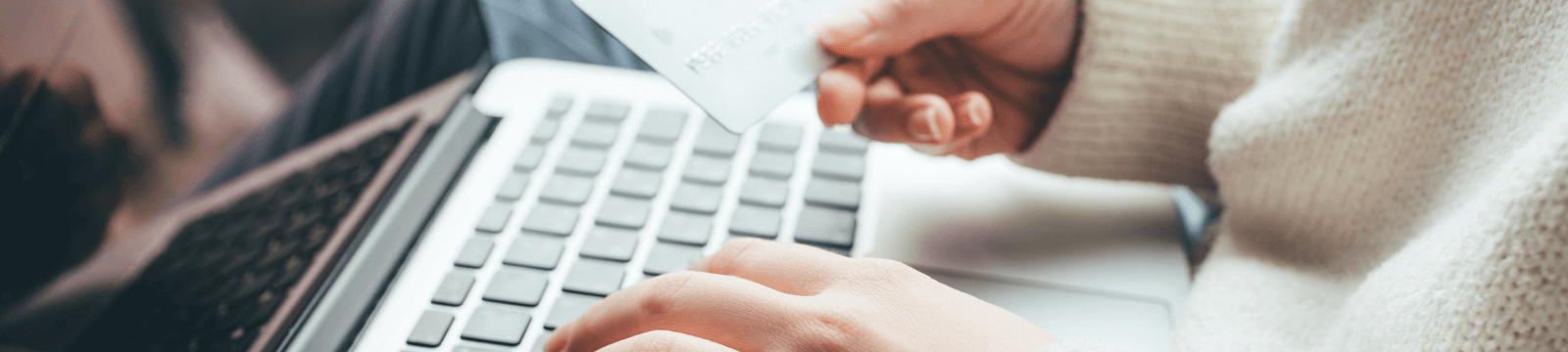 Person entering card information on computer