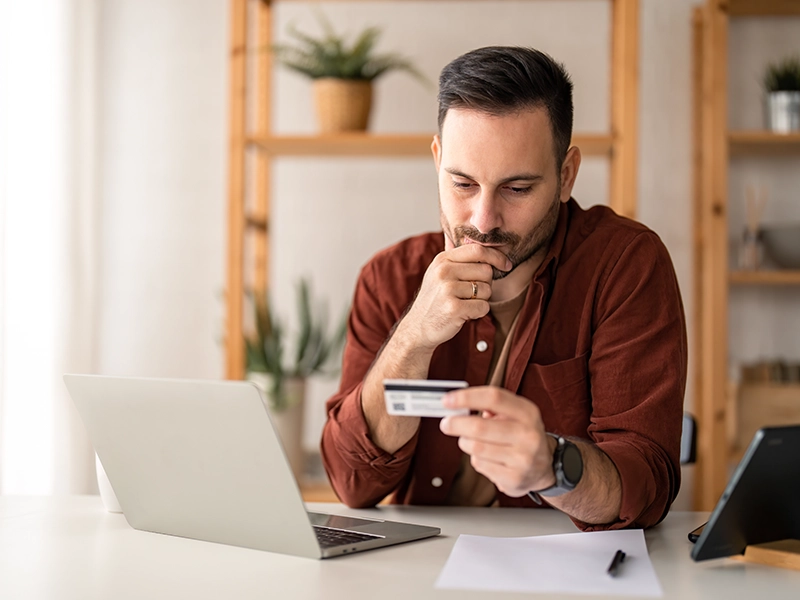 business man holding credit card
