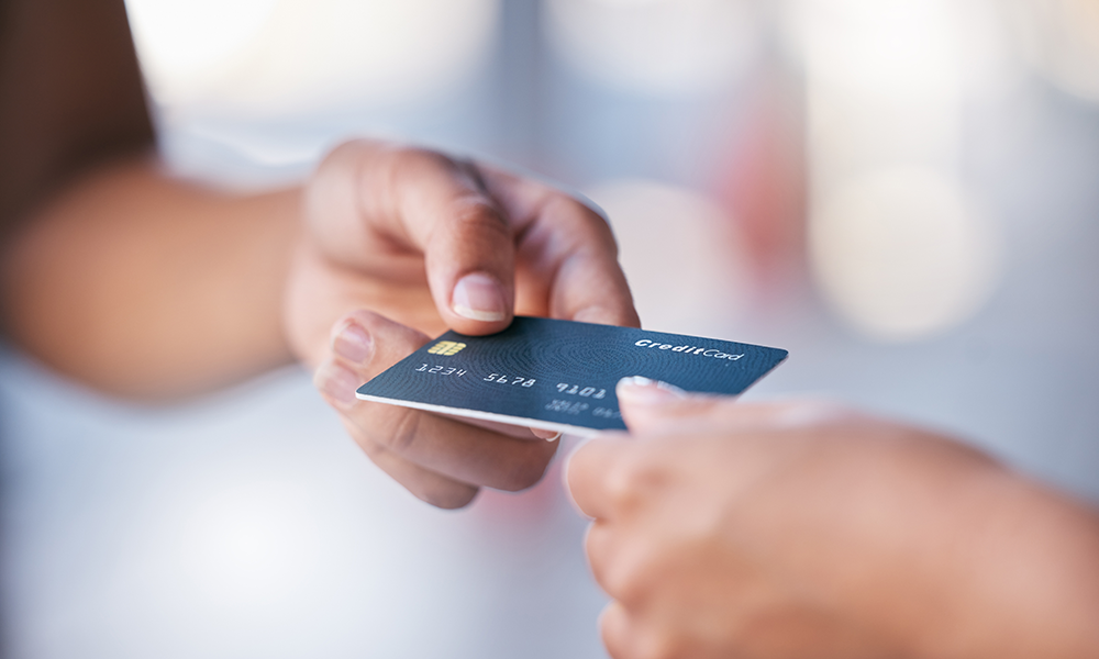 man paying with credit card