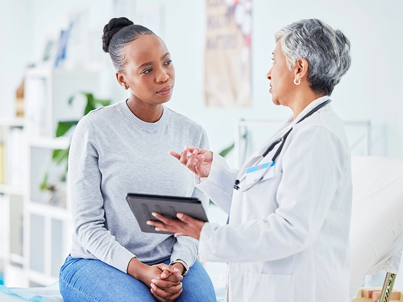 woman talking with doctor