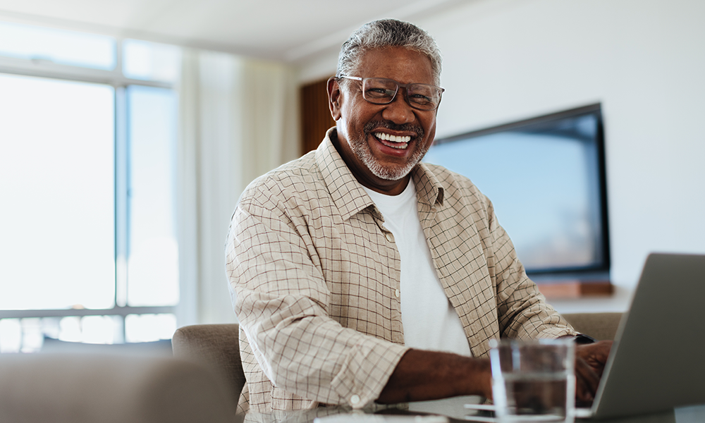 man banking on laptop